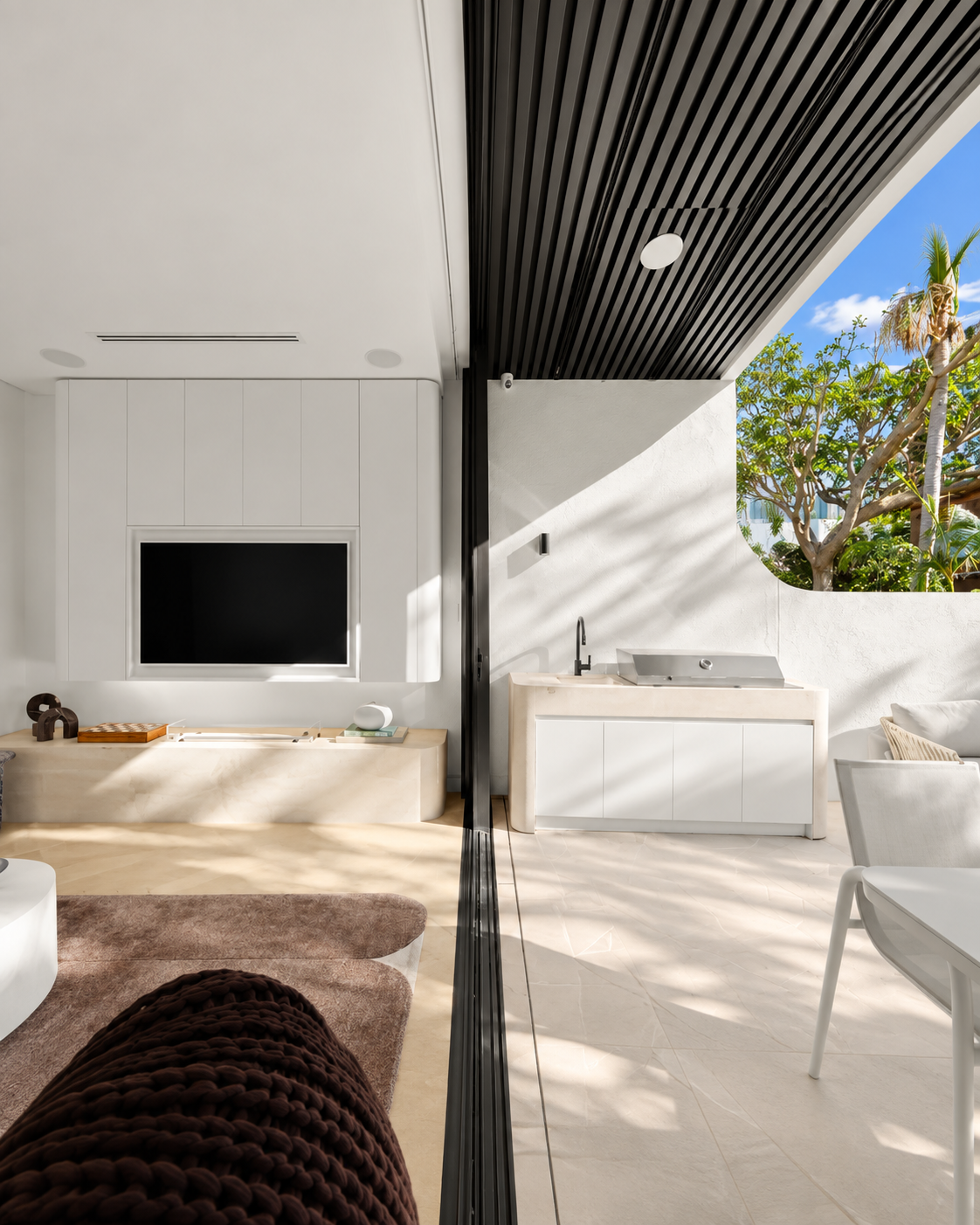 Covered alfresco dining and entertaining area with built-in BBQ
